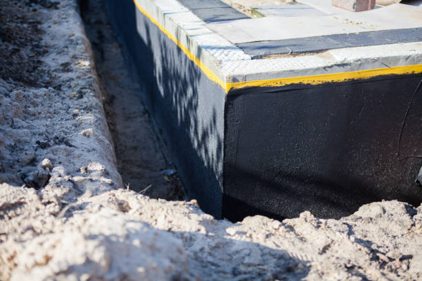Professional Waterproofing technician working in Utica, IN